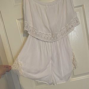 Ruffle sleeveless romper with crochet trim